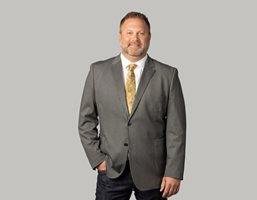 Matt wearing a grey suit