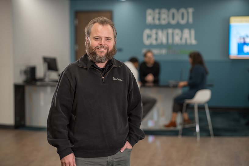 Jason DeWater stands in front of Reboot Central in the Digital Express.